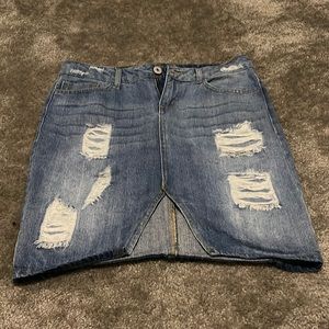Distressed denim skirt.